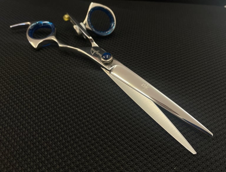 Sharpened pair of scissors being displayed on a mat