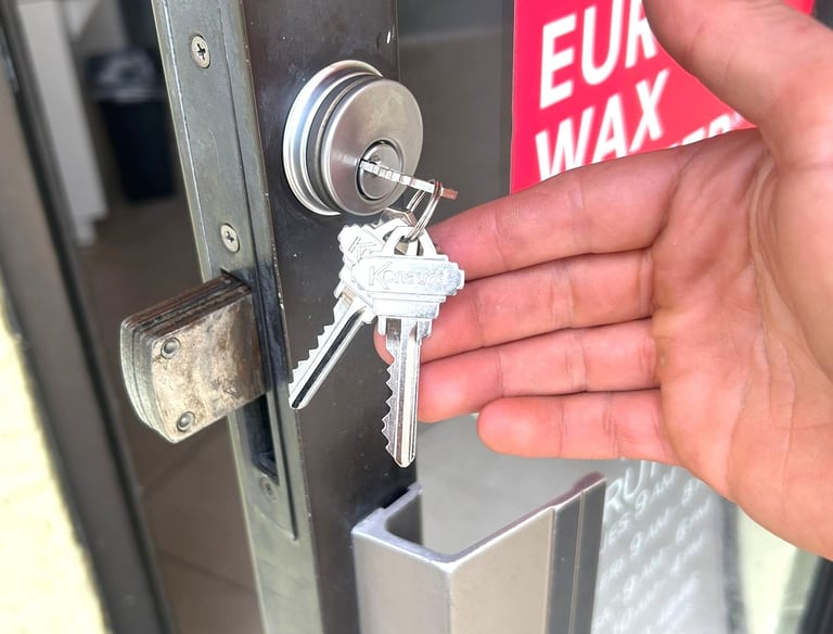 commercial locksmith repairing and rekeying a business door lock in Flagler County