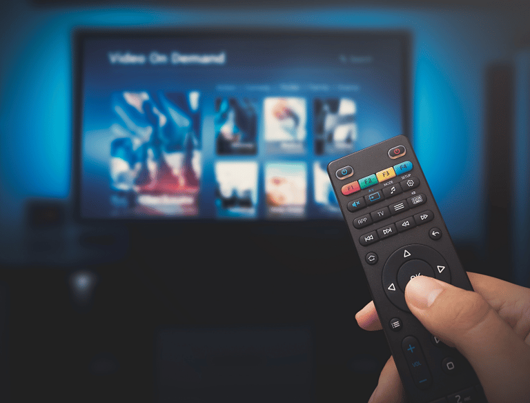 a person holding a remote control and needing support. troubleshooting