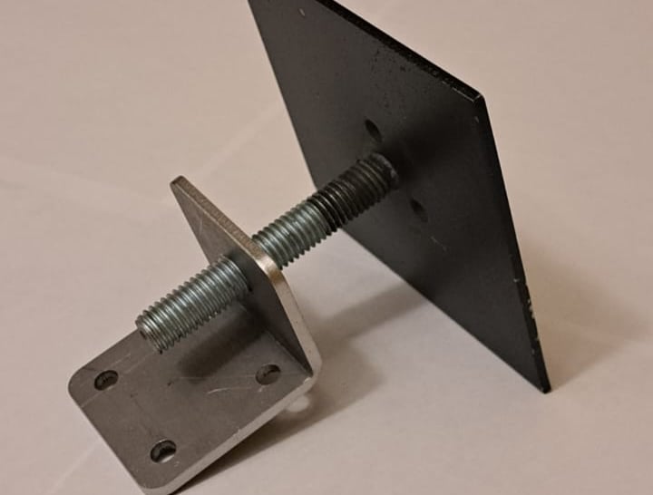 Heavy-duty metal anchor bolt with dual mounting plates for secure floor, wall or ceiling levelling installations