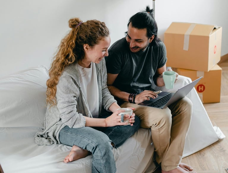 Happy couple on laptop
