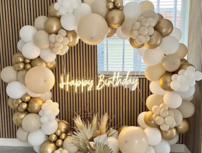 a birthday party with balloons and balloons