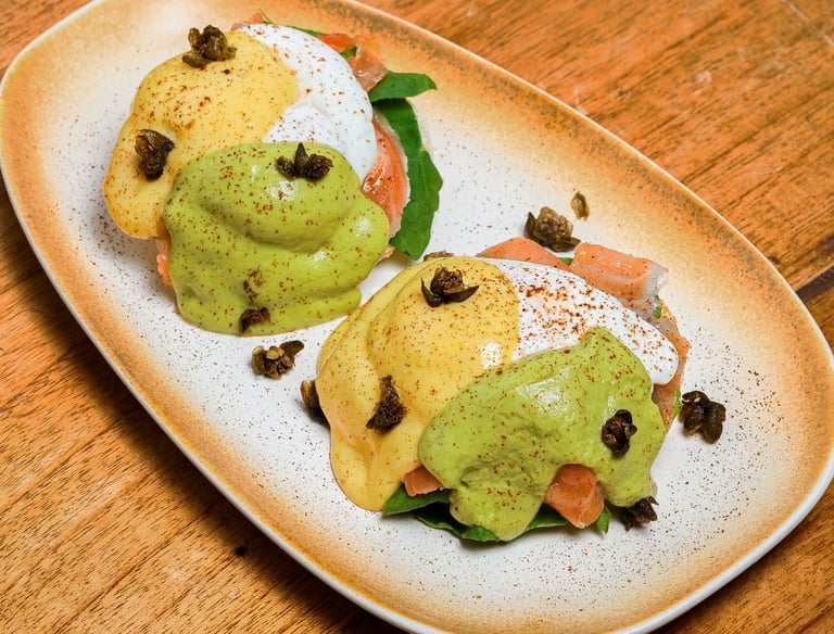 a plate of salmon egg benedict