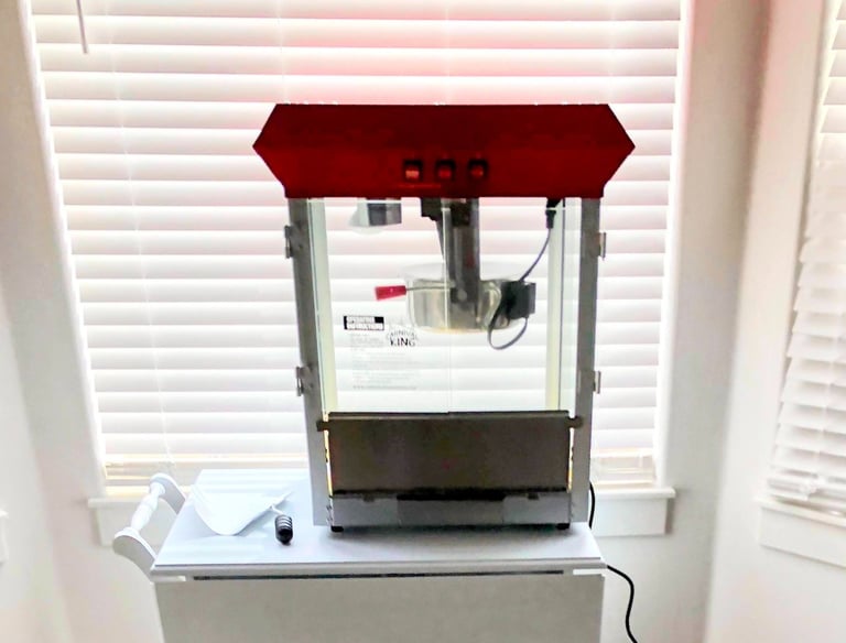 a popcorn machine on a cart