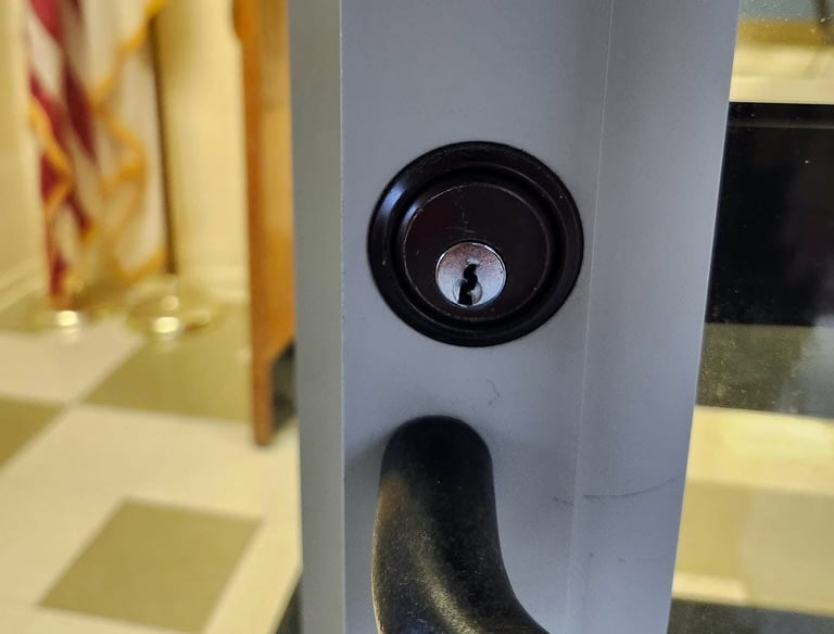 Close up of black lock on a business door representing inexpensive local locksmith of Mars Hill commercial services