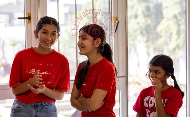 Students sharing a joyful moment at the aged home.