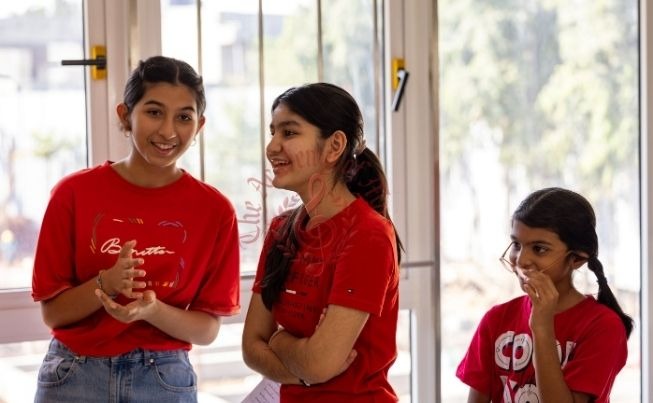 Students sharing a joyful moment at the aged home