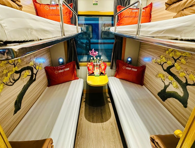 Hana Train Deluxe Cabin with four sleeper berths, modern interior, soft bedding, and spacious layout