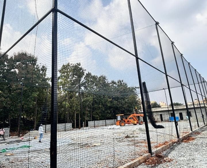 Close-up of durable netting material being measured and cut precisely.