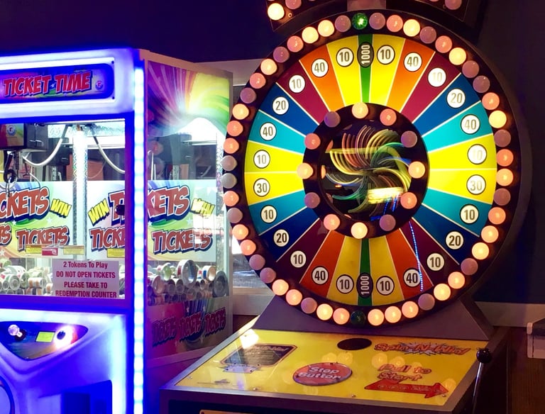 arcade game with wheel and bright lights