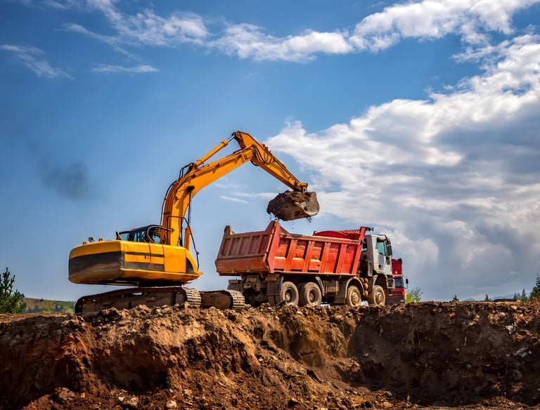 earthmoving and grading contractor preparing commercial construction site foundations Gulf South