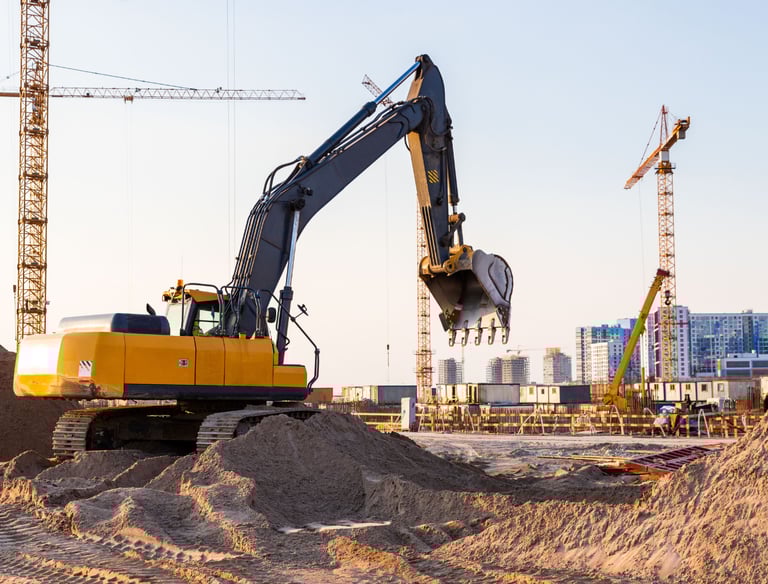 construction site preparation with excavator for commercial development
