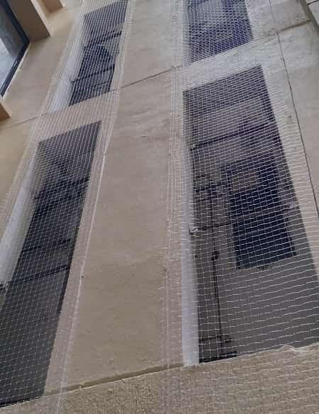 Close-up of strong, weather-resistant anti-pigeon net material.