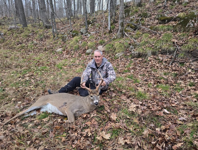 Hunter With a Recovered Deer
