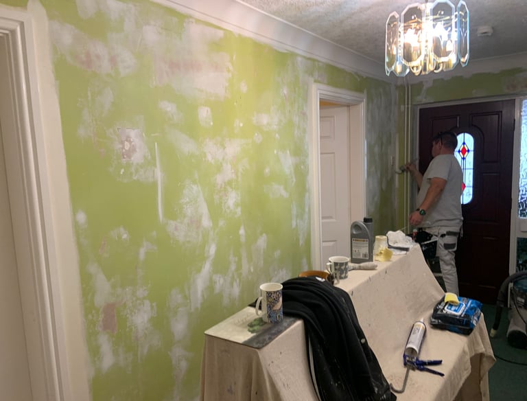 LPAD staff working near the front door of an in-process residential home.