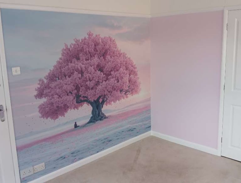 One wall with a mural depicting a cherry blossom tree, surrounded by a sky, sunset and pink field.
