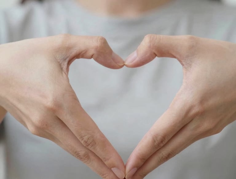 man doing heart hand sign