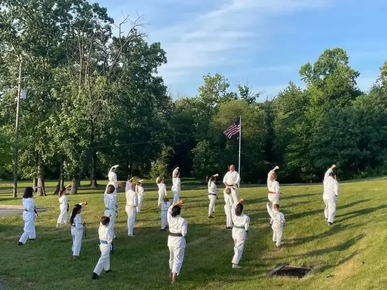 Students training karate outside
