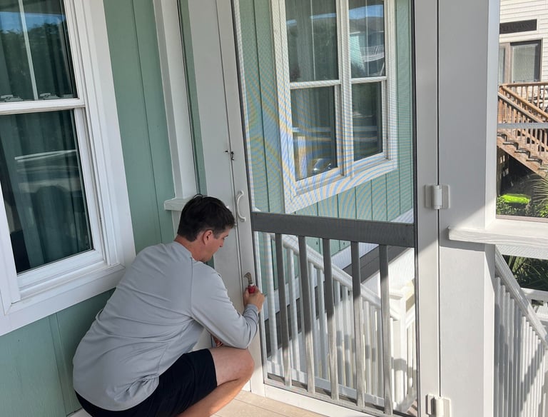 New screen door installation on a beachfront property in Georgetown County.