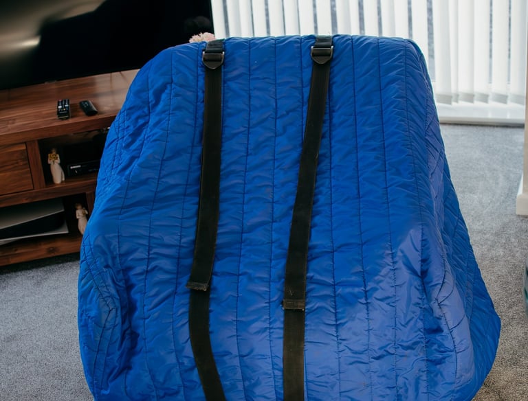 chair coverd in blue protective covering