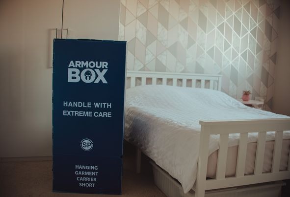 storage box next to a bed