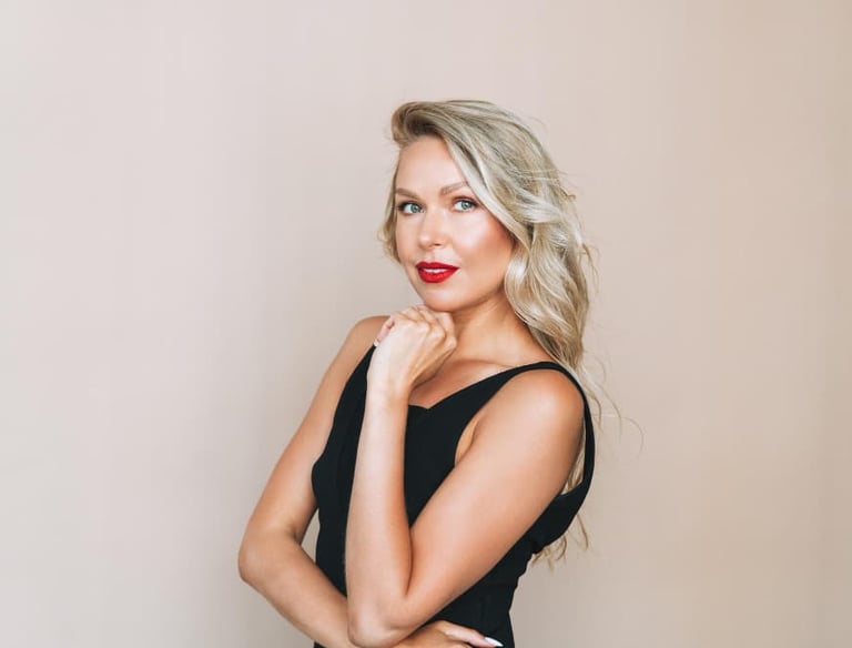 a sugar mommy in a black dress with a red lipstick on her lips