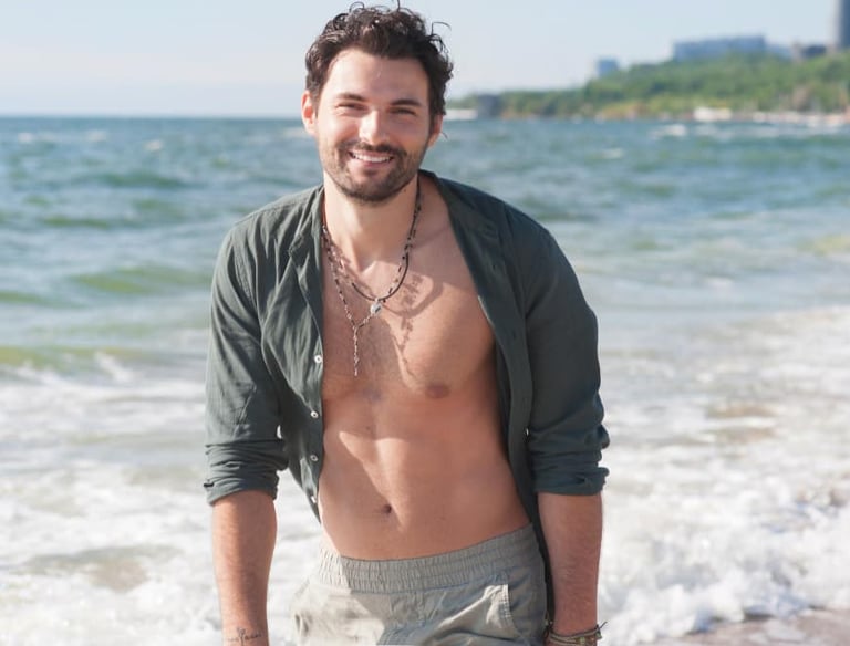 a sugar baby with a beard and a shirtless shirt