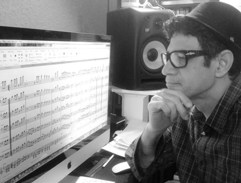 Maestro Bobby Ramirez composing and arranging music 