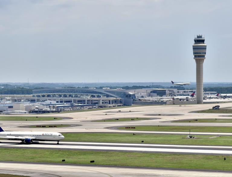 a plane taking off from a runway at an airport