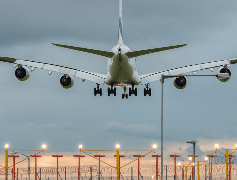 a large jetliner landing at an airport