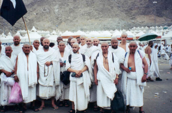 a group of men performing Hajj