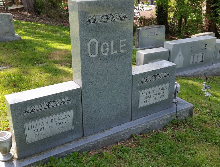 a group of tombstones with headstones and headstones