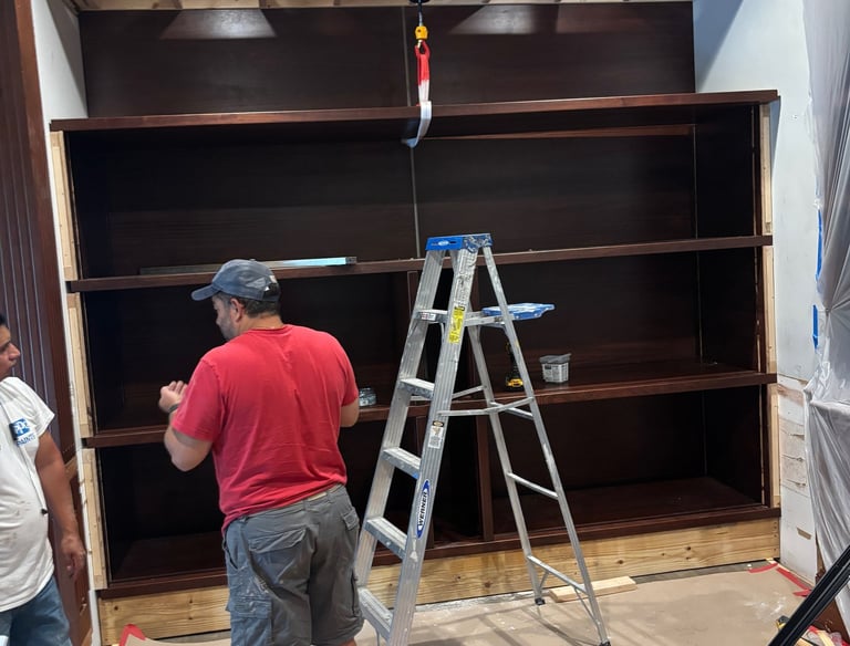 Professional carpenters working on custom made wall unit- Britto's Home Improvement