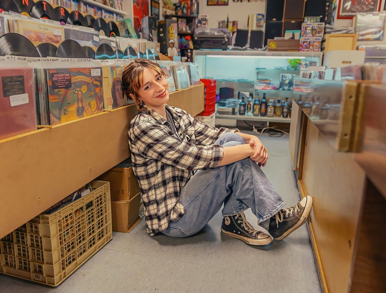 Senior pictures in a record store by Lititz PA senior picture photographer. Senior Rep Team Lancaster PA