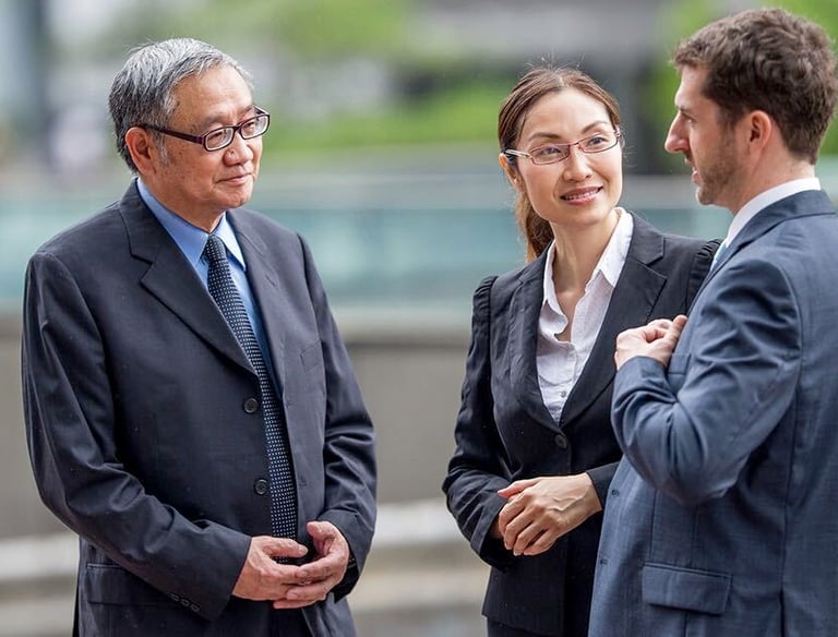 Asian Executive is talking to the interpreter