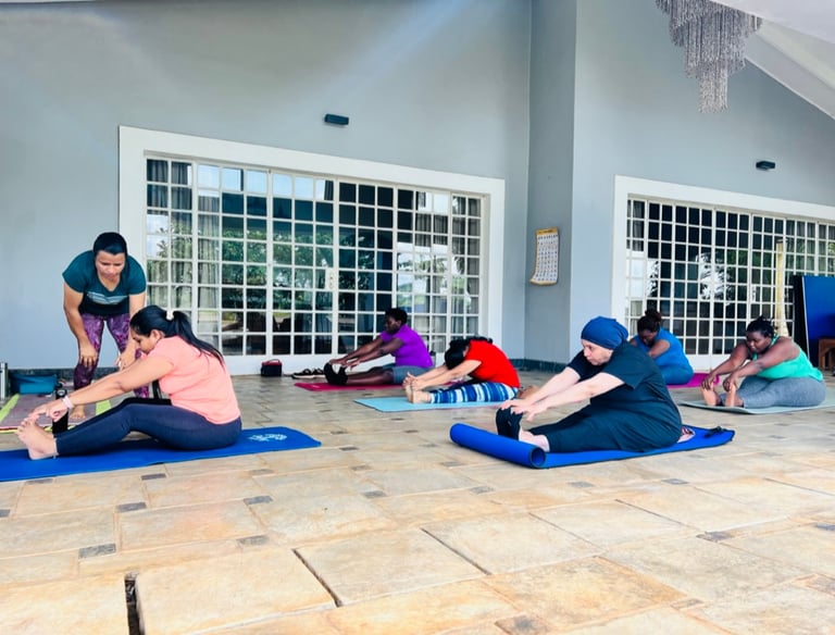 Posture correction with Yoga participants during the class