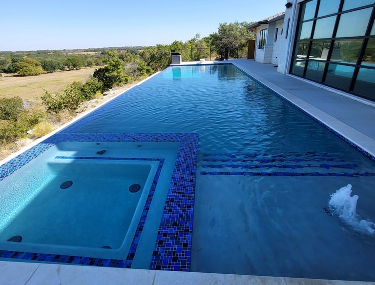 pristine blue swimming pool showing excellence in pool cleaning services, results, and satisfied customers