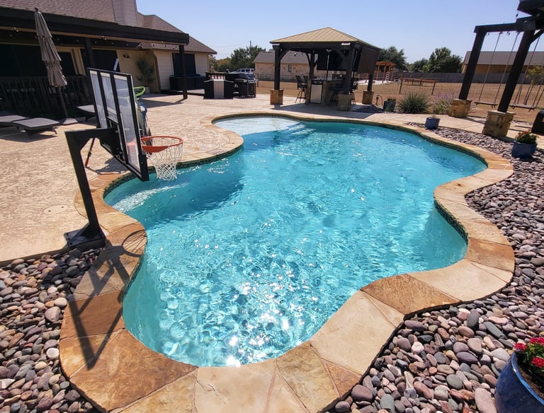 pristine blue swimming pool showing excellence in pool cleaning services, results, and satisfied customers