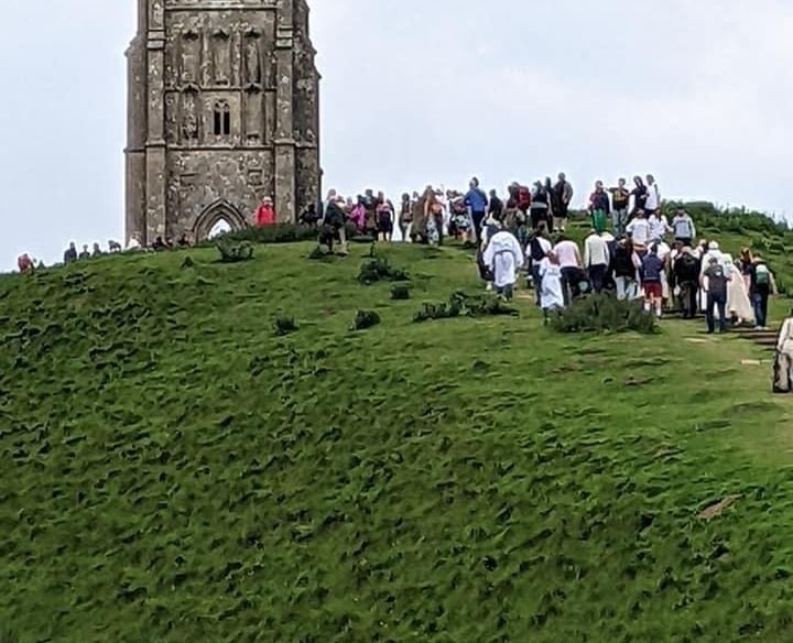 Spiritual seekers climbing Glastonbury Tor
