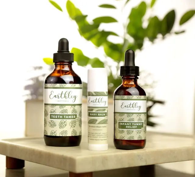 a bottle of earthy skin care products on a table