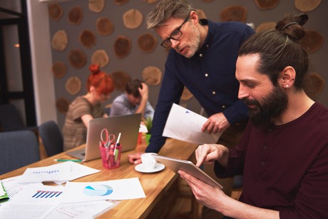 Saudi Food Registration Team brainstorming solutions at a conference table