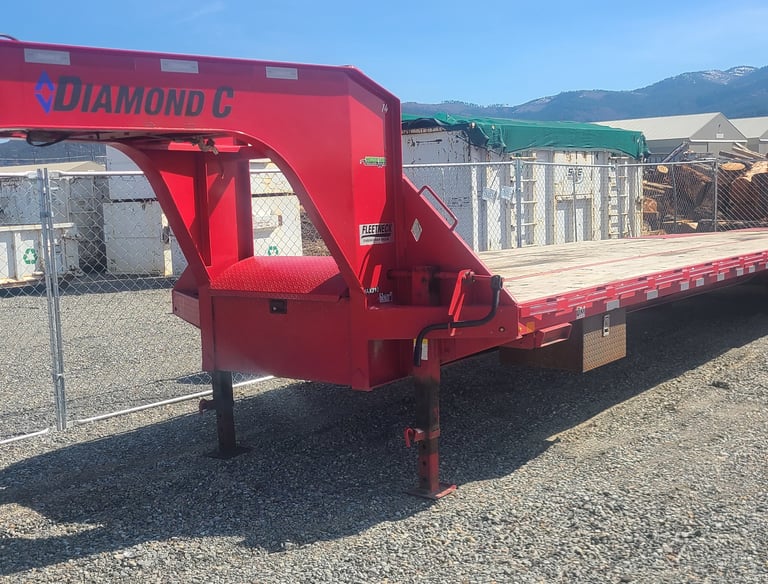 aa long red flatbed trailer