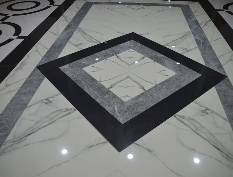 a marbled floor with a square shaped mirror