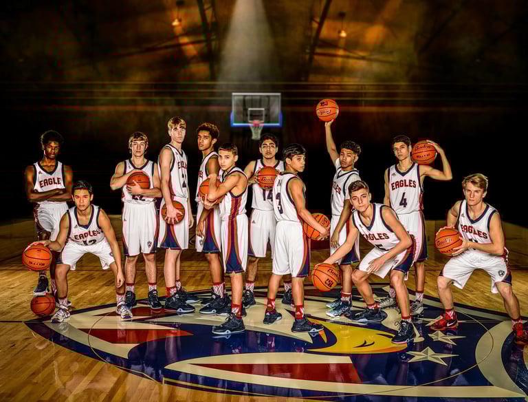 a group of young boys and girls basketball players posing for a photo