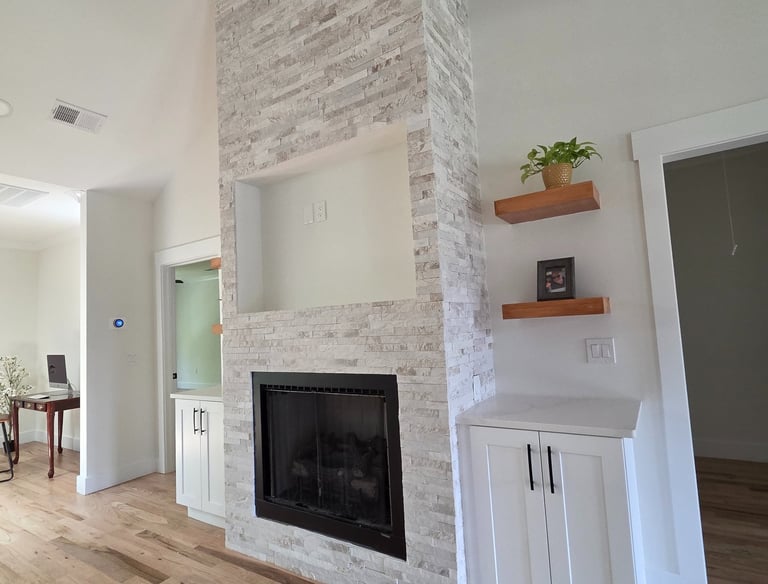 Fireplace construction and remodeling with expert stonework, modern finishes, and built-in features