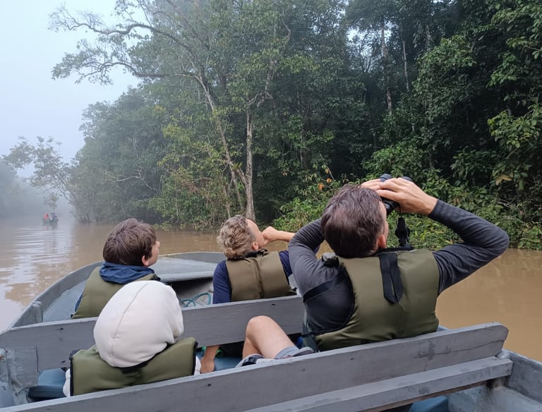 a group of people in a boat on a river