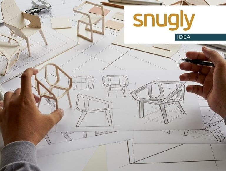 Designer sketching modern chair blueprints with wooden miniature furniture models for product development.