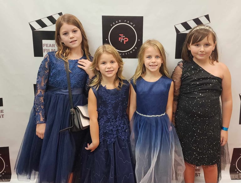 Youth participants attending a family-friendly arts event organized by Fear Fame Arts Foundation