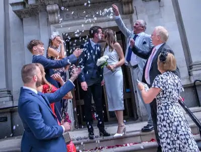 confetti being thrown on the steps of Islington Town Hall