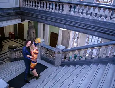 newly-weds on the marbled staircase inside Islington Town Hall